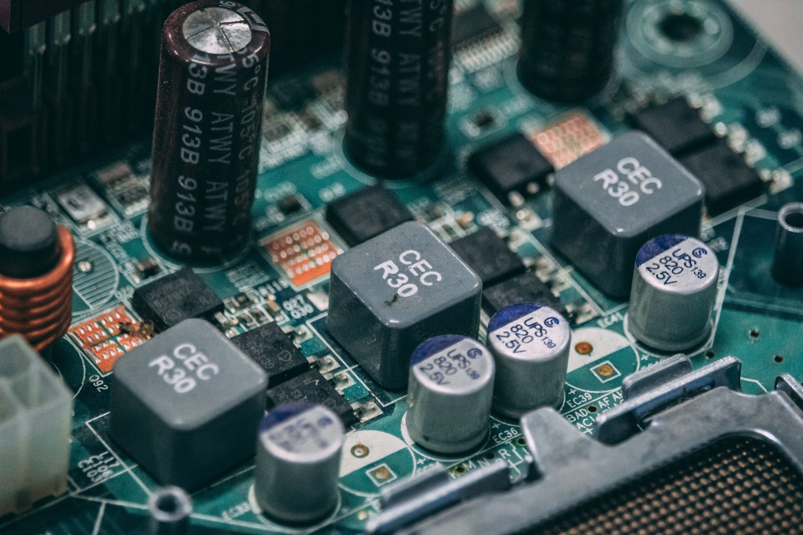 Detailed view of electronic components on a circuit board showcasing capacitors and semiconductors.